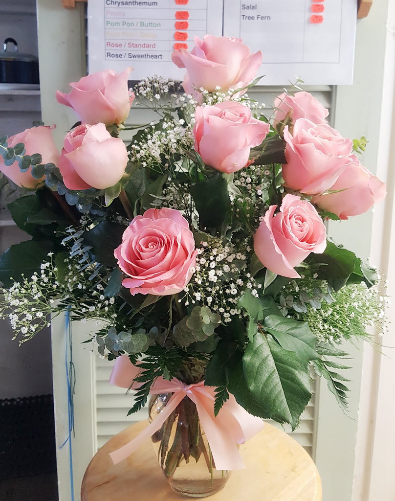 12 pink roses beautifully wrapped in Brooklyn, NY
